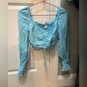 blue long-sleeve top